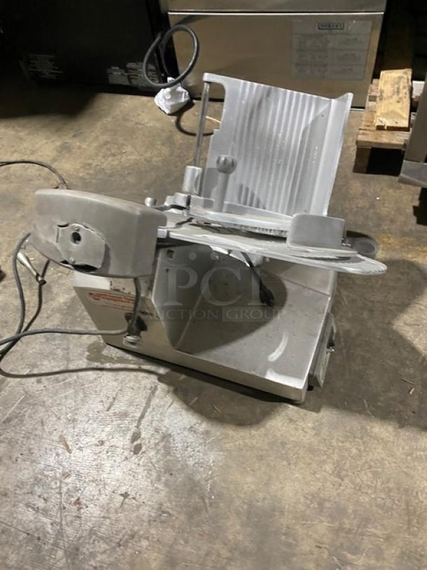 Hobart EDGE medium duty deli meat slicer, model 21-1005506, 120V 1 phase, angled feed, on legs, commercial use.