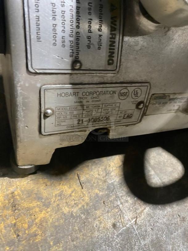 Hobart EDGE commercial deli meat slicer, serial 21-1005506, 120V, 1 phase, on legs, label visible.