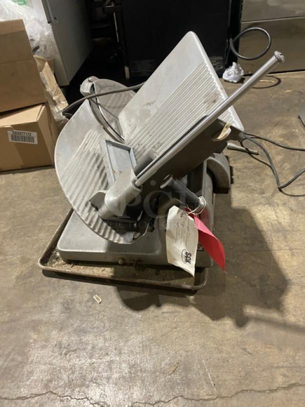 Hobart Model 1612 commercial deli meat slicer on legs, electric-powered. Features include adjustable blade and safety guard.