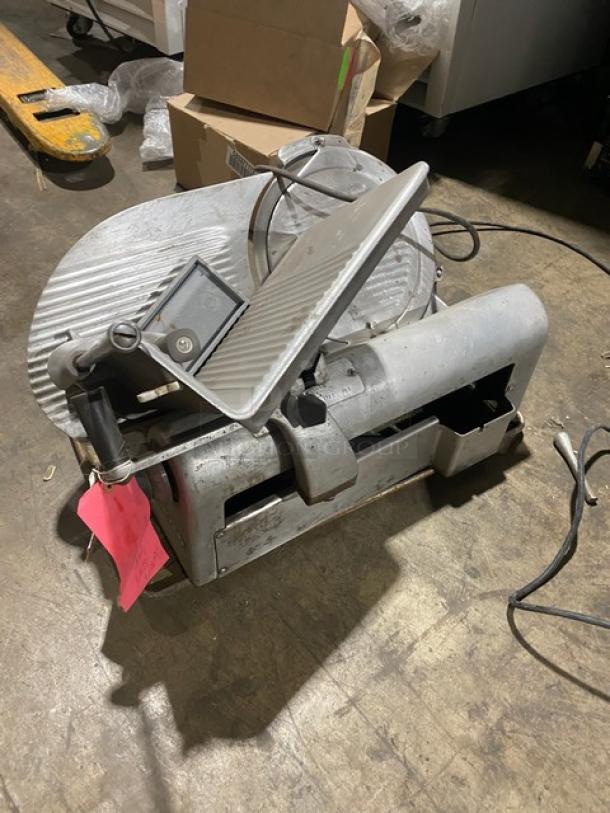 Hobart Model 1612 deli meat slicer, electric, countertop design, on legs, visible wear, serial number 1725, with power cord.