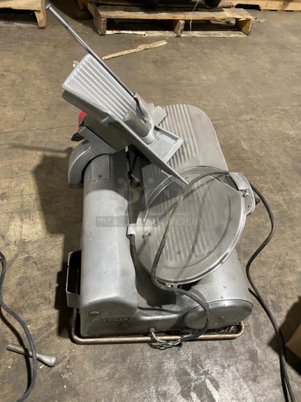 Hobart 1612 commercial electric deli meat slicer, countertop model, used condition, visible power cord, label with serial number 1725.