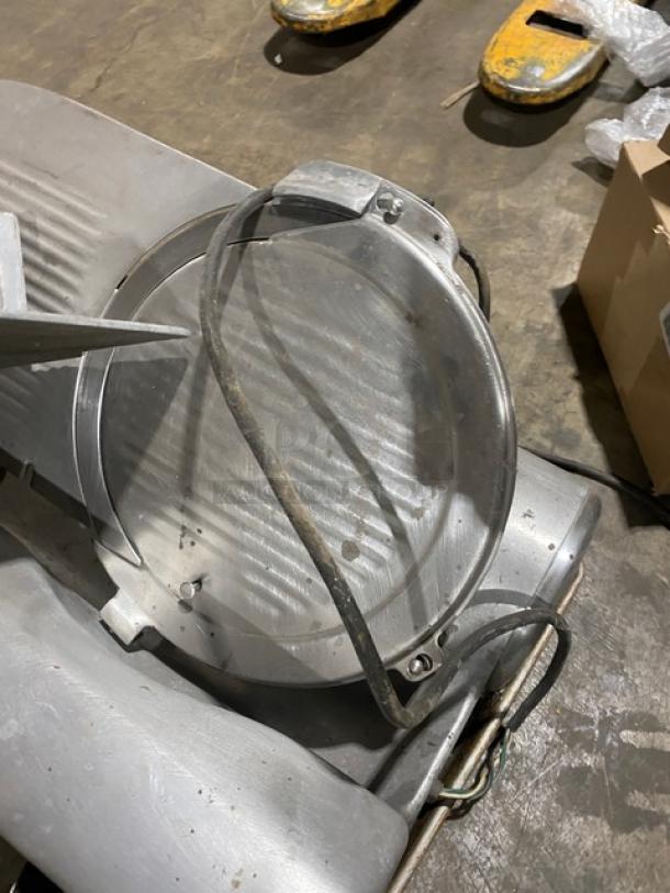 Hobart Model 1612 commercial meat slicer with electric power, countertop design, on legs. Serial number 1725 visible.