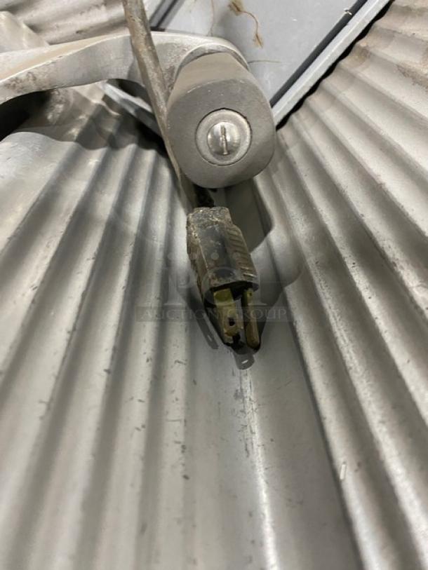 Hobart Model 1612 commercial deli slicer. Electric-powered, countertop model with legs. Serial number 1725 visible.