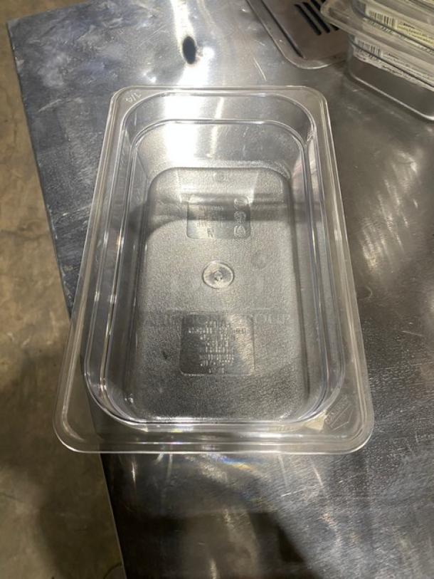 New Cambro commercial food pan, clear polycarbonate, 1/4-size, 2.5" deep, model 42CW135, excellent condition.