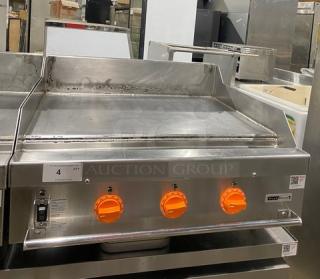 Woodstone WSGPL3636CT01NG 36" stainless steel flat griddle, natural gas, with back and side splashes. Model and serial labels visible.