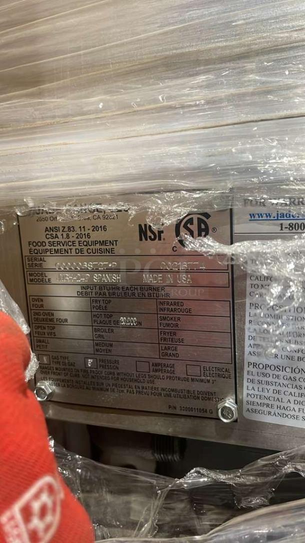 Brand new Jade Range Jade Range Trio Combo Unit JURH-CHP; features 24" char broil grill, 24" flat plancha with 2-drawer fridge base, stainless steel backsplash, on casters.