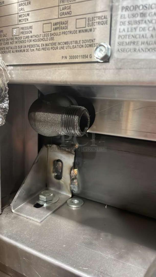 Jade Range gas-powered unit detail showing part of the assembly with visible serial label and P/N 3000011054.