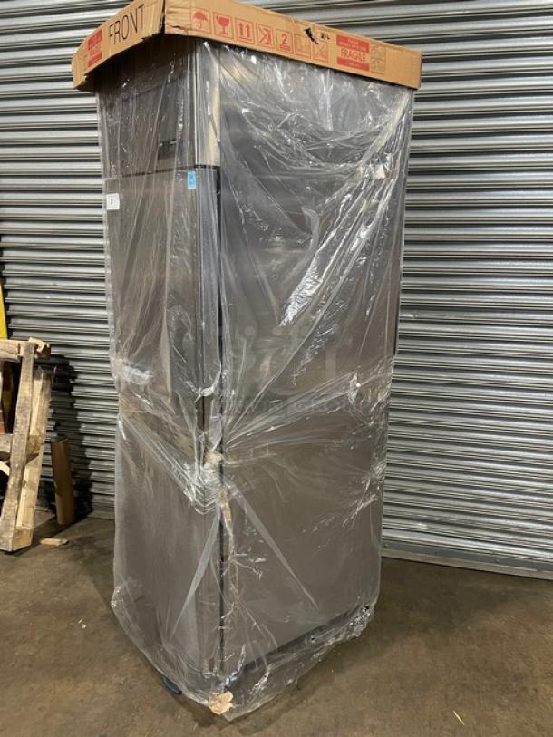 Blue Air BSR23T top mount cooler in new scratch-n-dent condition, wrapped in plastic, on casters, model and serial tags visible.