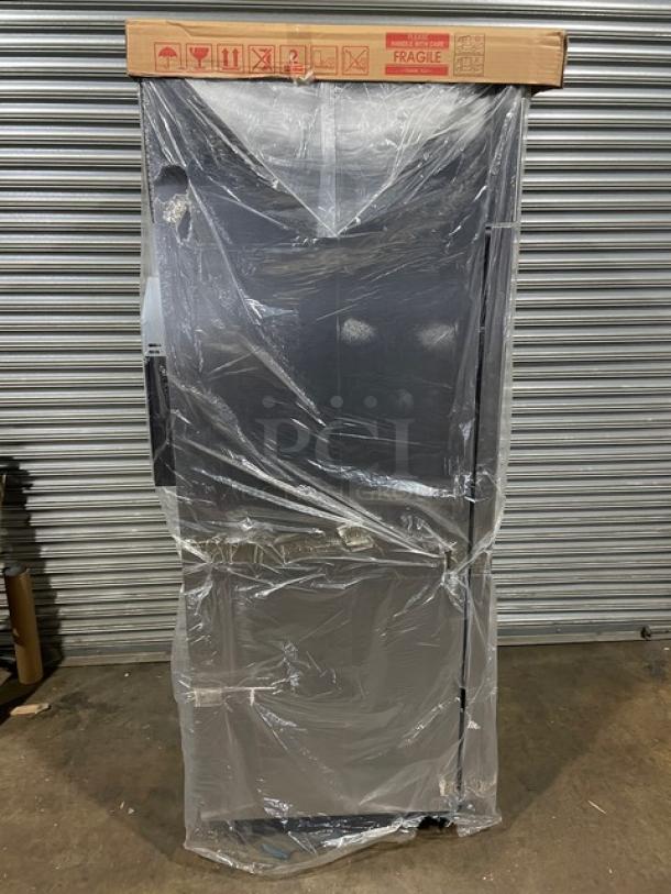 Blue Air Model BSR23T one-door top mount cooler, new with scratches, on casters, wrapped in plastic, 115V.
