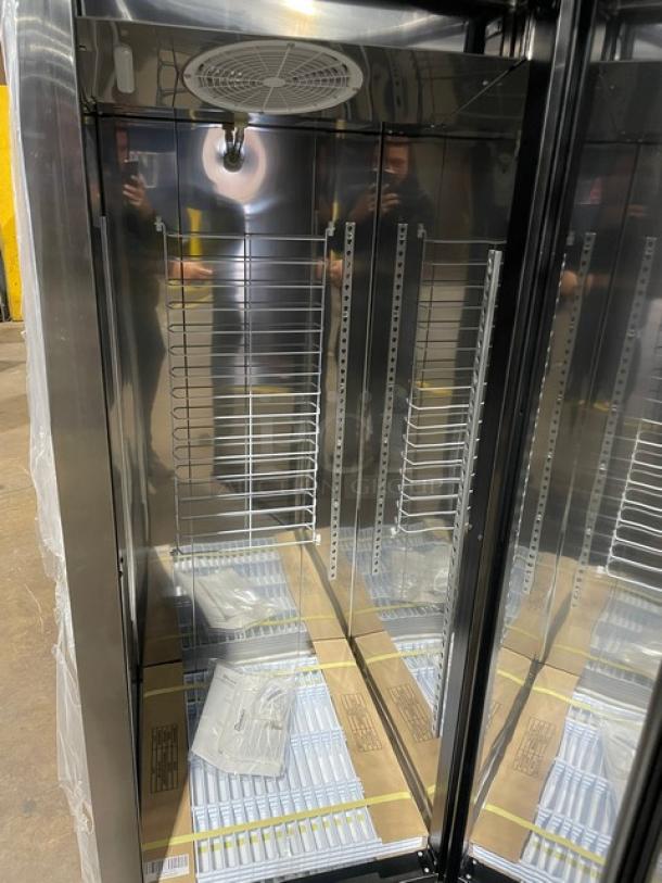 Alt text: Blue Air BSR23T one-door top mount reach-in cooler, scratch-n-dent, new condition, interior shelving, caster wheels.