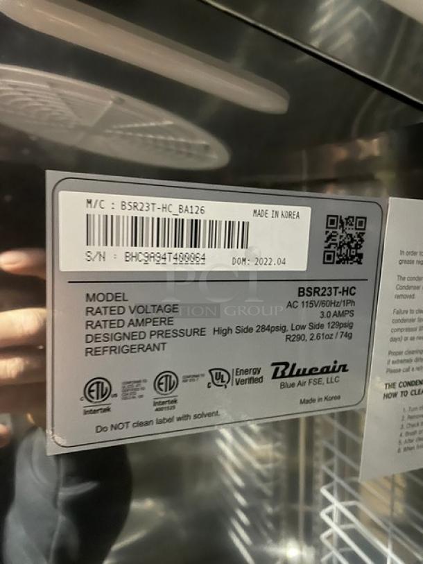 Blue Air BSR23T one-door top-mount reach-in cooler, scratch-and-dent condition, serial BHC9A94T400064, on casters, 115V 1 Phase.