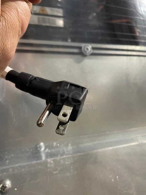 Blue Air BSR23T reach-in cooler, serial BHC9A94T400064, scratch-n-dent condition. Features 115V plug, top mount, on casters.