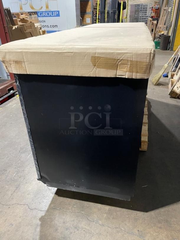 Blue Air BDD90-4D kegerator cooler, new in box, with visible cardboard packaging. Solid black exterior shows minor handling marks.