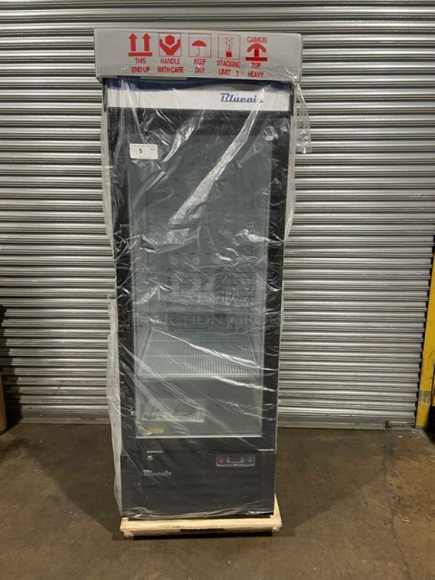 Blue Air glass door reach-in freezer model BKGF23-HC, new condition, on casters, 115V, 1 phase, visible handling labels.