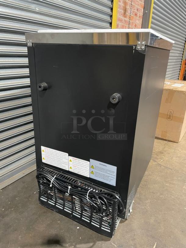 Blue Air BBB23-1B one door bar back cooler on casters with stainless steel top. New condition, minor scratches. Model and warning labels visible.