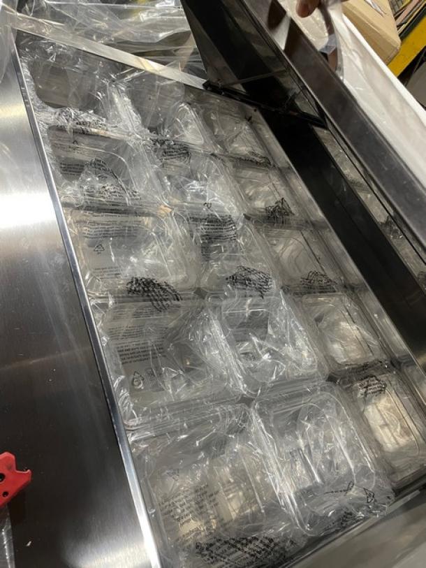 Brand new Blue Air BLMT36 Refrigerated Mega Top Sandwich Prep Table in original packaging, 36", 115V, on casters.