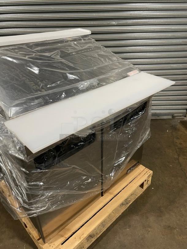 Brand new Blue Air 36" refrigerated mega top sandwich prep table, model BLMT36, on castors, wrapped in packaging.