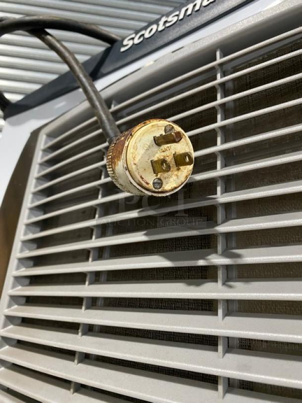 Scotsman NS0422A-1B air-cooled nugget ice machine plug against metal vent. Serial 22101320017020.