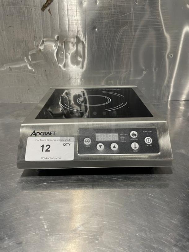 Adcraft INDB120V single burner induction cooker, stainless steel, new condition, digital controls, model and serial visible.