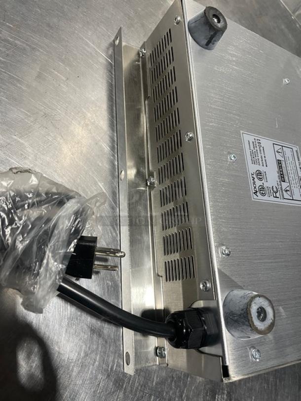 Adcraft INDB120V induction cooker, new, stainless steel body with visible power cord, model and serial number label.