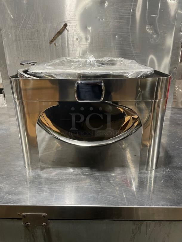 Stainless steel chafing dish with handles and drop-in pan, new condition, reflective finish, buffet style.