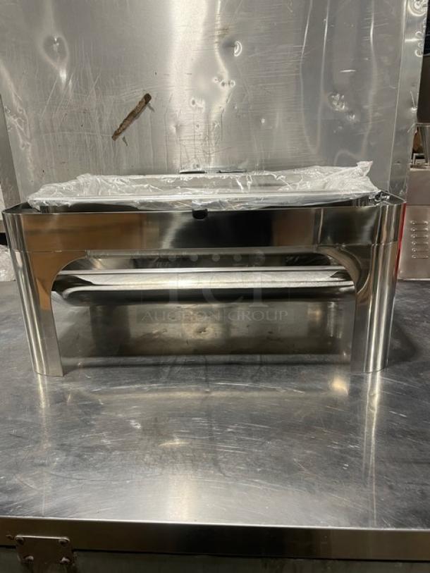 Stainless steel buffet chafing dish with handles and drop-in pan. New condition, reflective finish, ideal for catering.