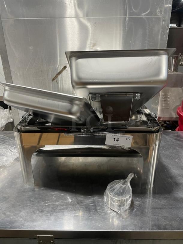 Stainless steel buffet style chafing dish, new, with handles and drop-in pan. Item tag marked "14 Qty."