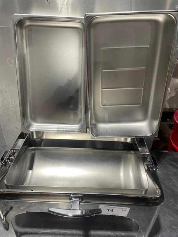 Stainless steel buffet-style chafing dish with handles and drop-in pan, new condition.