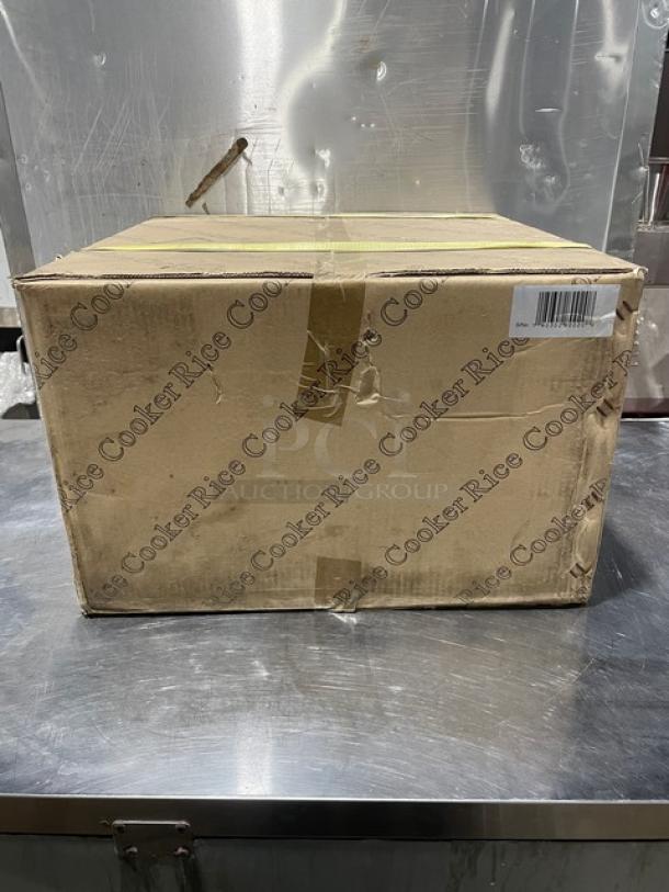 Brand new Adcraft Countertop 50 Cup Rice Cooker/Warmer in box; features stainless steel lid, aluminum interior, 208/240V.