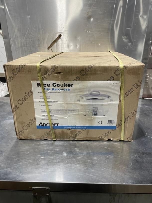 Brand new Adcraft 50-cup rice cooker/warmer in box. Features stainless steel lid, aluminum interior, 208/240V.