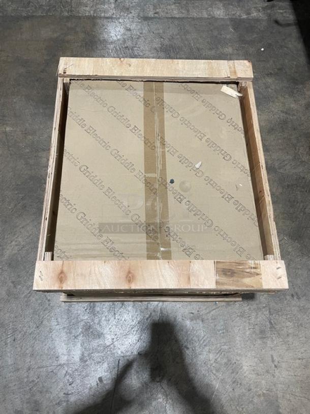 New Adcraft 16" commercial electric griddle in crate. Features stainless steel, back and side splashes, 120V, new condition.