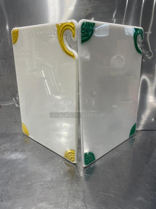 Brand new San Jamar Saf-T-Grip cutting boards with colorful corner grips. Two boards included, excellent condition.
