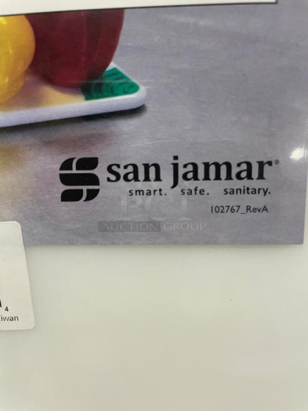 Brand new San Jamar Saf-T-Grip cutting board, white, with non-slip corners. Logo showing "smart. safe. sanitary."