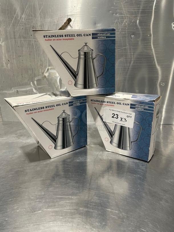 Brand new Adcraft OC-24 stainless steel oil cans in box. Set of three. Packaging shows model name and features.