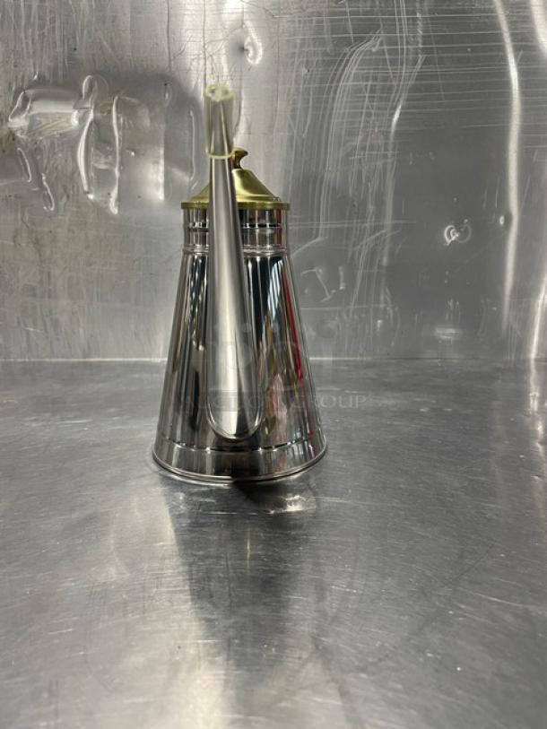 Adcraft OC-24 stainless steel oil can, brand new, with a sleek design, brass cap, and elegant spout, in original box.