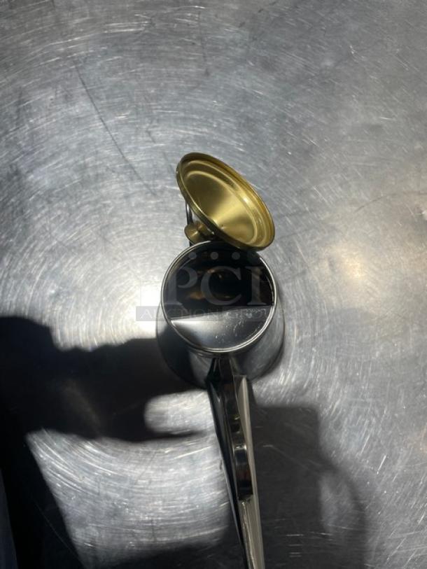 Brand new Adcraft OC-24 stainless steel oil can with open lid, shiny finish, and original packaging.