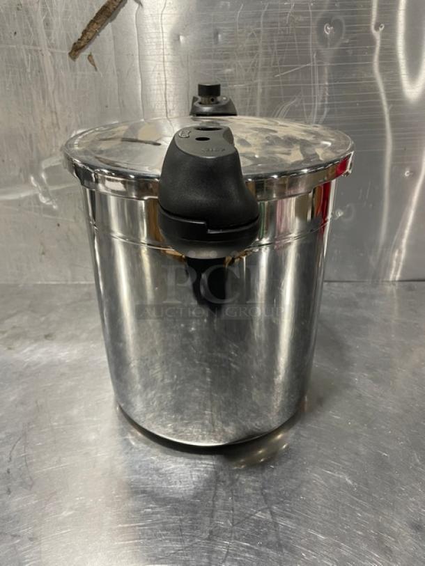 Sitram 13 Liter Pressure Cooker, new condition, with lid and handles, part of Sitramax Series, stainless steel finish.