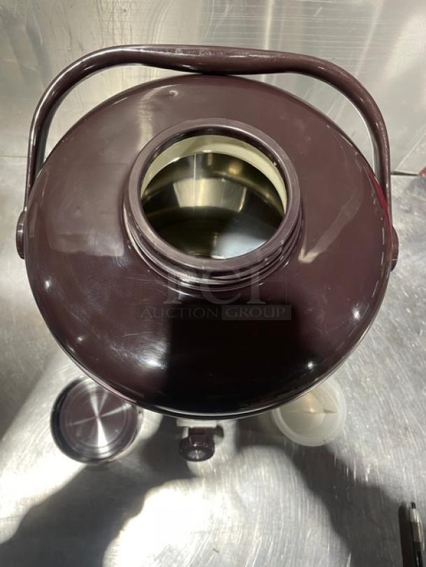 Adcraft BDI-10 10 Quart Insulated Beverage Server, stainless steel body, new with carrying handle and lid, top view.