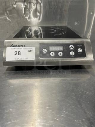 Adcraft INDB120V induction cooker, stainless steel, new condition, digital controls, model and serial numbers displayed.