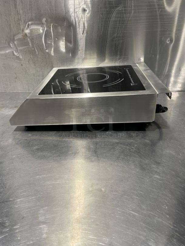2015 Adcraft INDB120V induction cooker, stainless steel body, countertop single burner, new condition, model visible.
