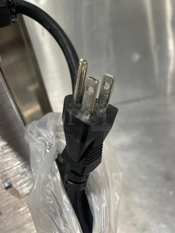 Adcraft INDB120V induction cooker plug. Black, three-prong; new condition. Part of the 2015 stainless steel model.