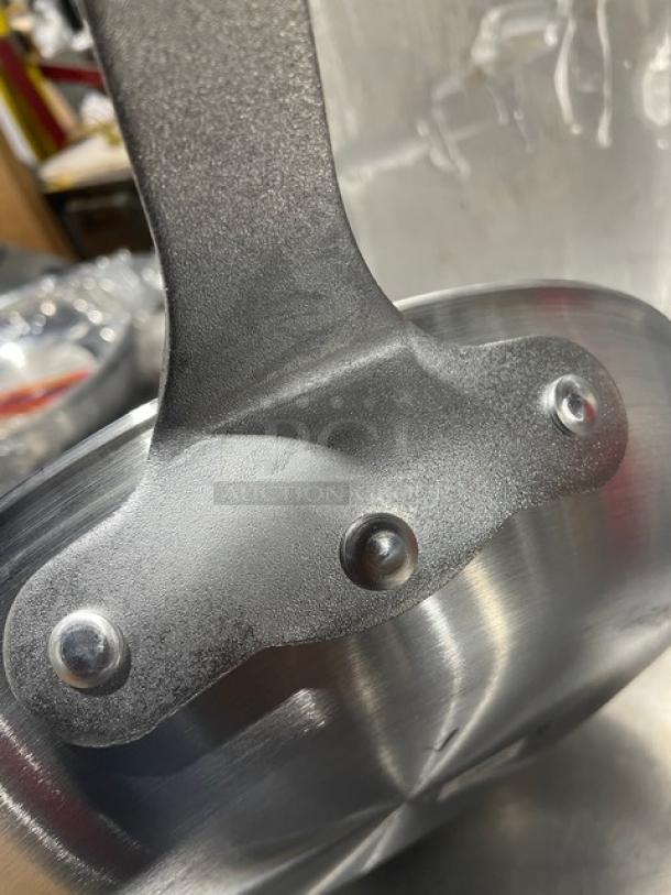 New Adcraft HER-12FP/4 aluminum frying pan with rubber grip handle. Visible rivets, brushed finish. Unused condition.