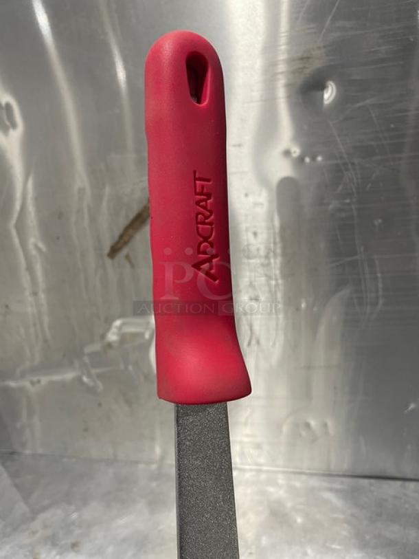 Adcraft frying pan Model HER-12FP/4 with red rubber grip handle, new condition, features brand logo.