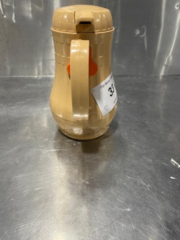 NEW Service Ideas insulated ABS plastic coffee carafe with a push-button lid, beige color, new condition.