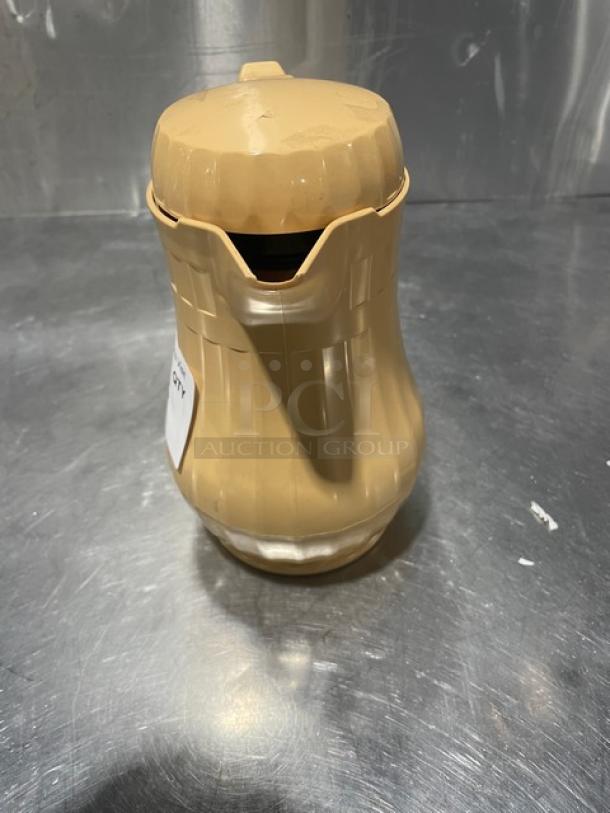 New Service Ideas insulated ABS plastic coffee carafe with push button lid, beige color, excellent condition, auction item.