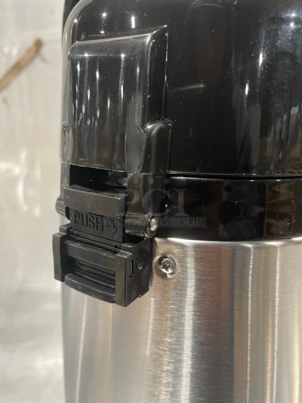 Service Ideas 2.5L glass-lined air pot, model ECA22S, new in box. Features push-button mechanism, stainless steel body.