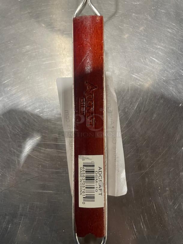 Adcraft Deluxe 10" Double Mesh Strainer, Model DSM-10, new condition with wooden handle and barcode label.