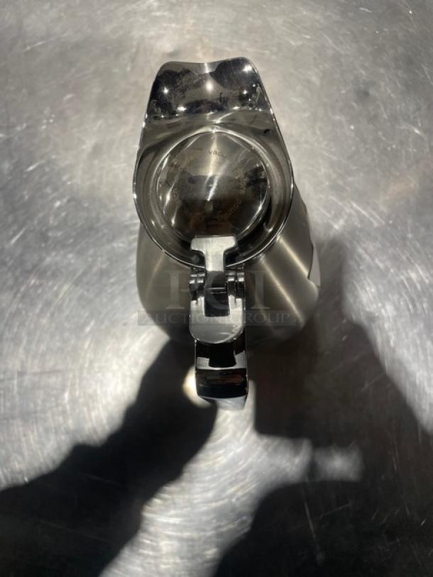 Spring beverage server, model 17600-5, 1-liter, stainless steel liner, top view showing lid, new condition.