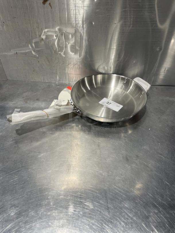 Adcraft 12" frying pan, Titan Series, stainless steel, model FPSI-12, new condition, handle wrapped, item tag visible.