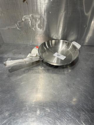 Adcraft 12" frying pan, Titan Series, stainless steel, model FPSI-12, new condition, handle wrapped, item tag visible.